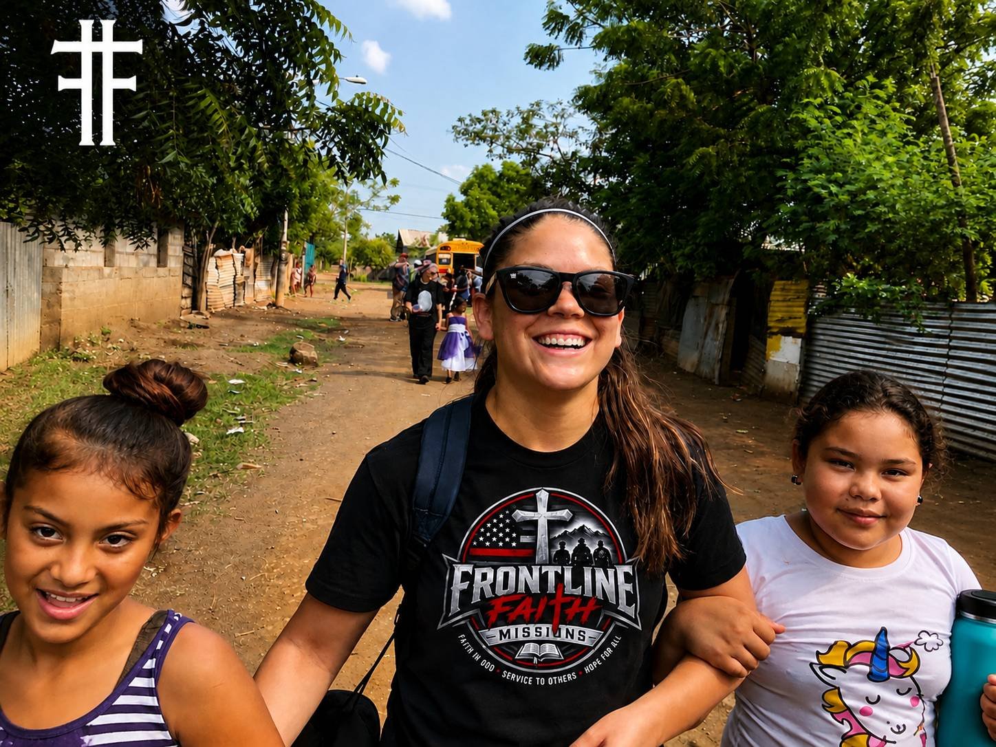 A Frontline Faith Missions volunteer walking with two children during a mission trip