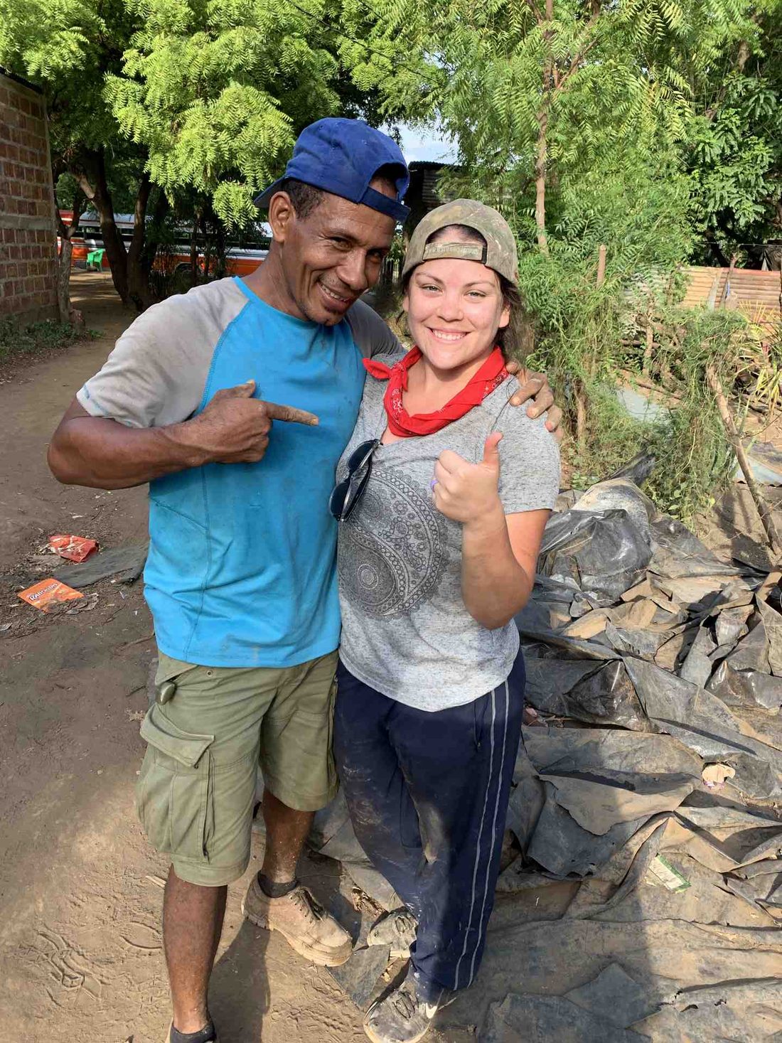A team member and a local worker on site together